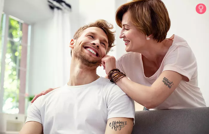 playful mother and son sporting mama-son label minimalist tattoo