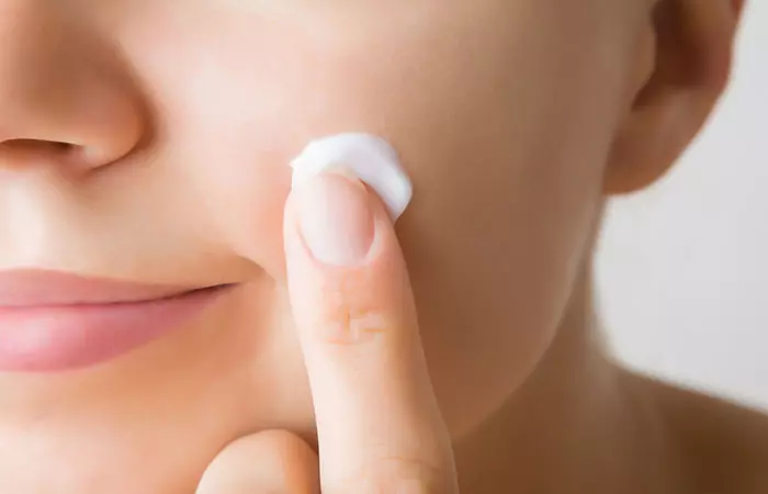 Applying Body Lotion On The Face