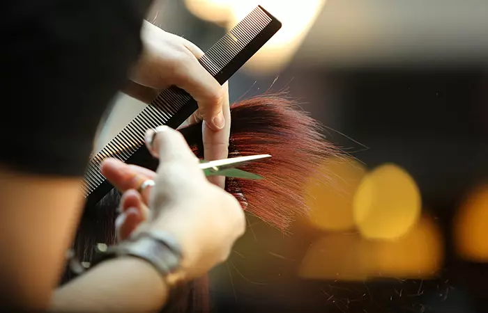 A girl cutting her split ends