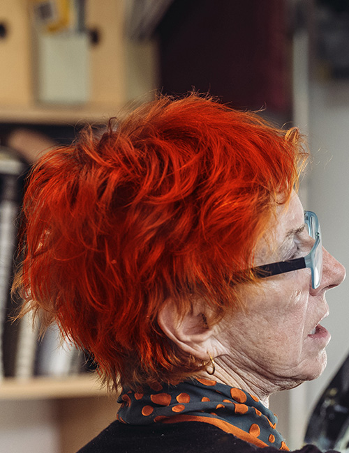 Dimensional pixie hairstyle for older women with glasses