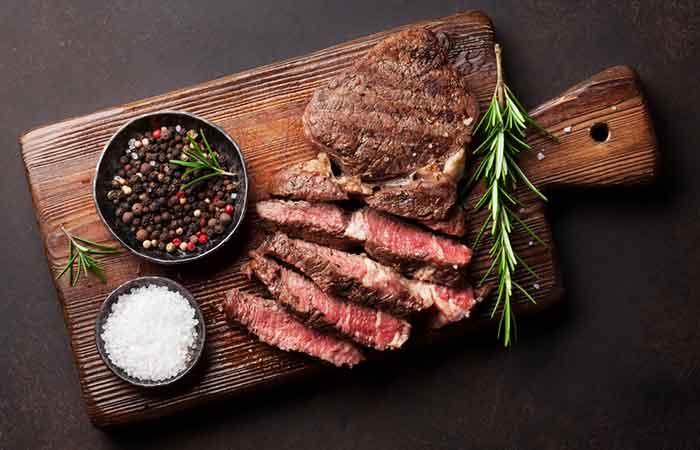 Pan-seared ribeye beef steaks on a cutting board
