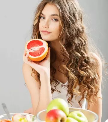Woman Using Grapefruit For Skincare