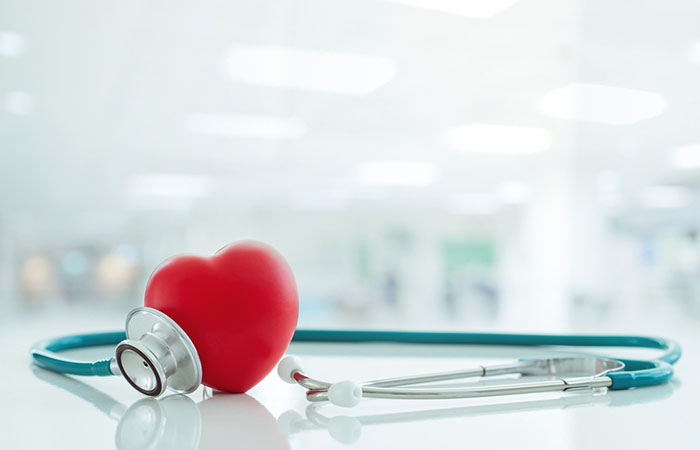 A stethoscope placed around a heart-shaped sports ball