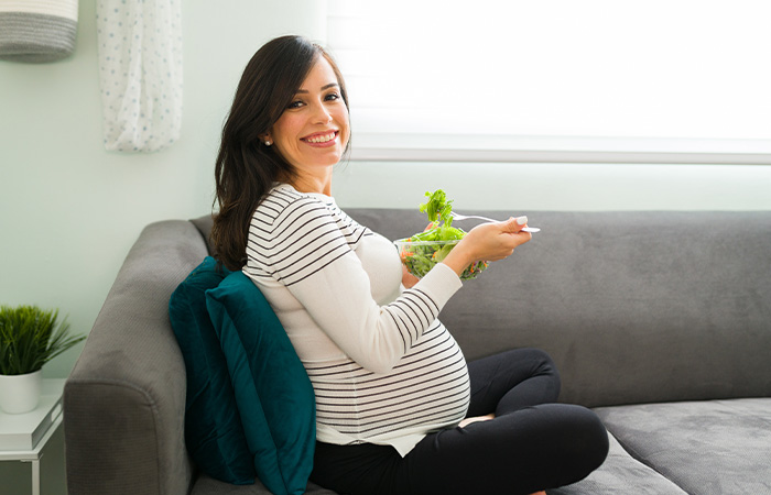 Pregnant woman enjoying her meal