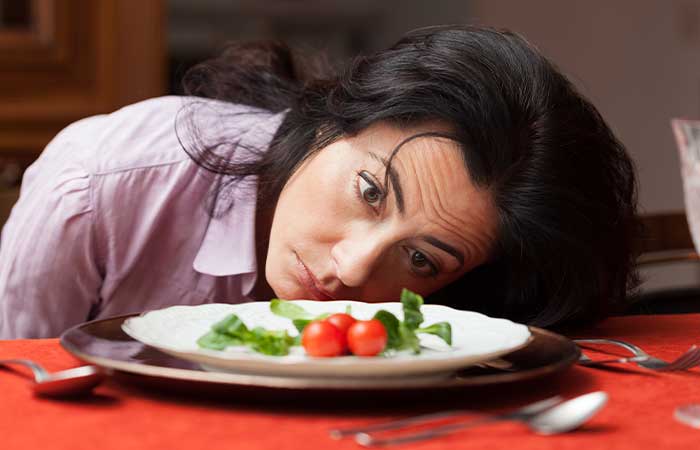 woman looks sad about dieting