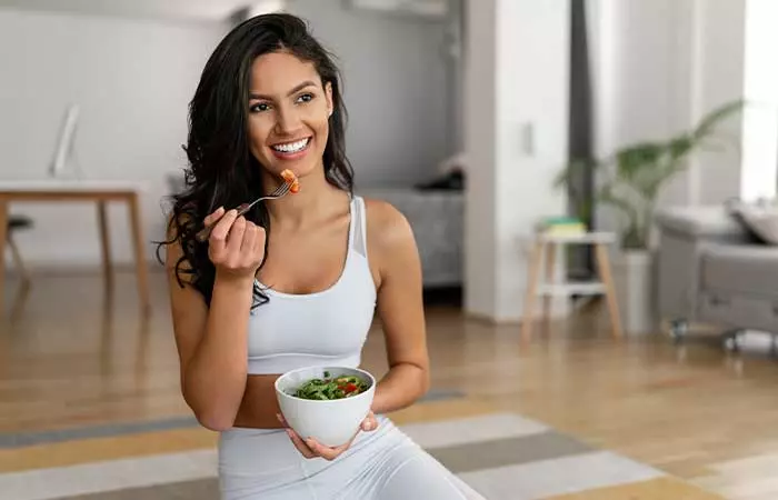Woman having low-calorie salad on a reverse diet
