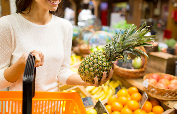 Woman selecting low potassium fruits