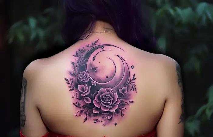 A purple rose tattoo on the back with a mystical witchy concept