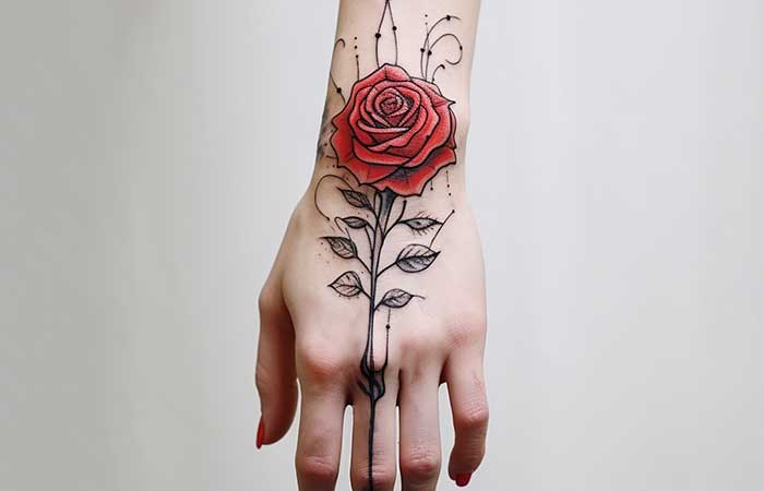 A tattoo of a red rose springing out of a finger