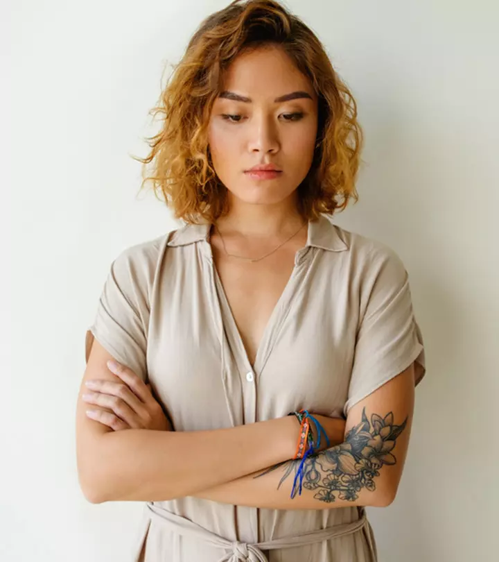 A woman with tattoos is unsure about her decision