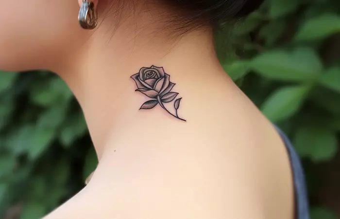 A black and gray minimal rose neck tattoo