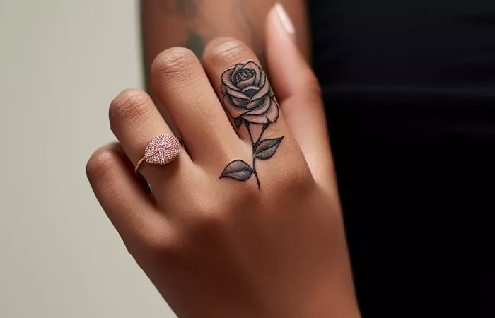 A simple rose tattoo on the index finger