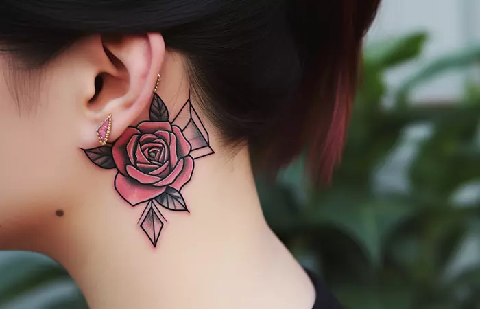 A geometric neck rose tattoo behind the ear