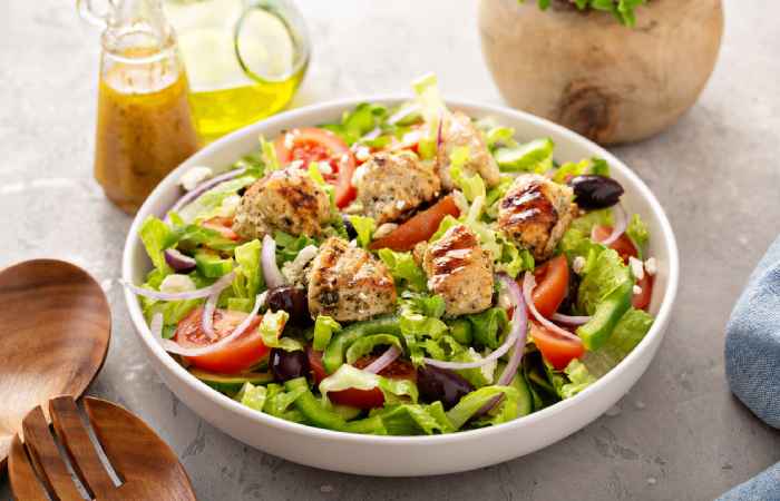 Greek salad with grilled chicken in a bowl