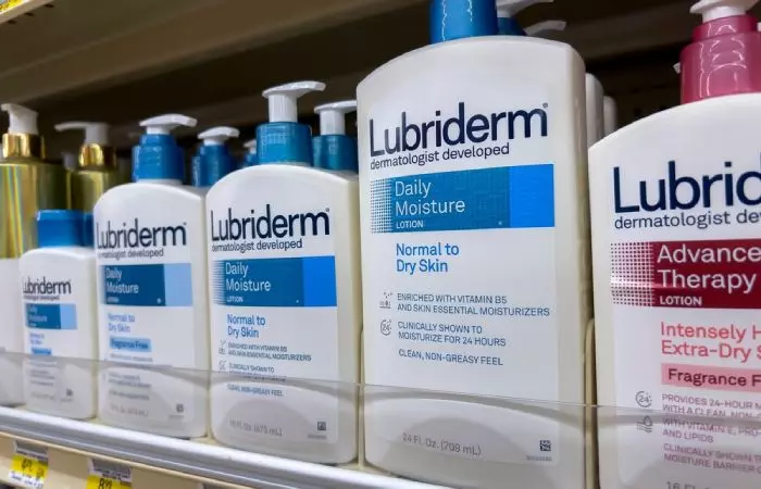 Lubriderm lotion for tattoos on a shelf in a medical store.