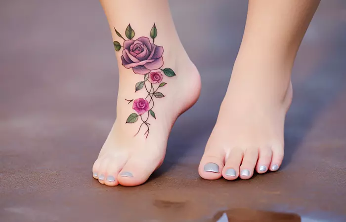Miniature pink and purple rose tattoo on the feet