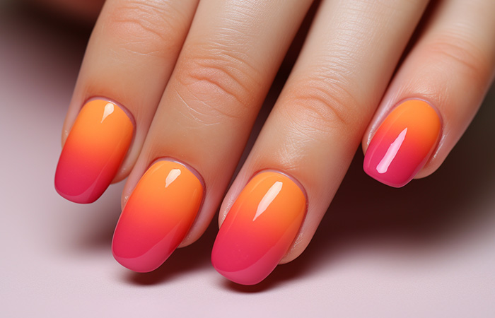 Orange-pink ombré nails