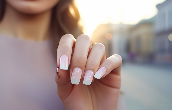 French tips with a pink ombré effect on square-shaped nails