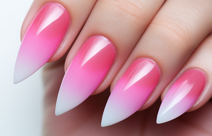 Ombré effect with bright pink, soft pink, and white nail polish