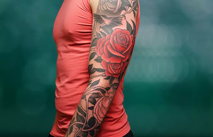 An electric rose and eagle wings on a tattoo sleeve