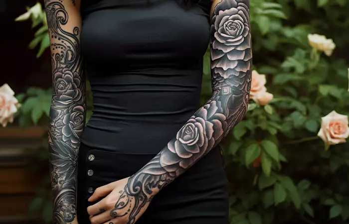 An ultra realistic ornamental style black rose tattoo