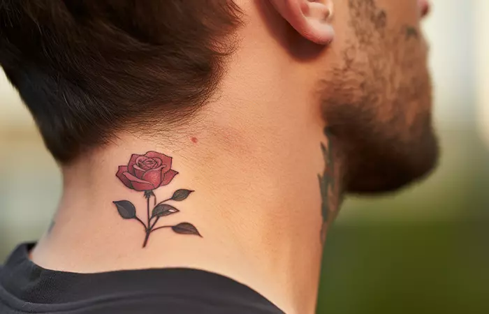 A traditional rose motif tattoo at the nape