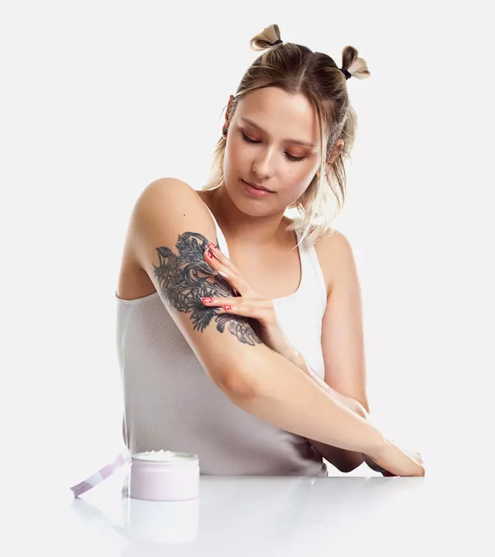 Woman uses Aquaphor for tattoo healing