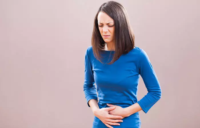 Woman with gastrointestinal issues due to flaxseeds