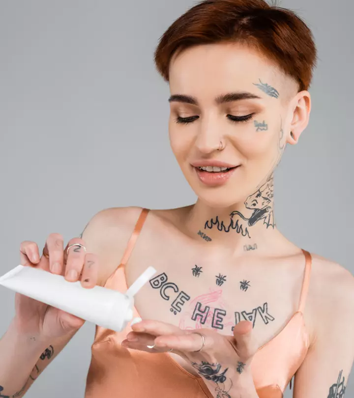 Women applying numbing cream