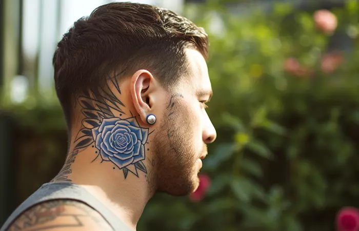 A blue rose neck tattoo with solid shading