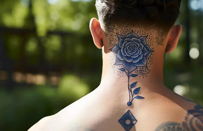 A blue rose mandala neck tattoo