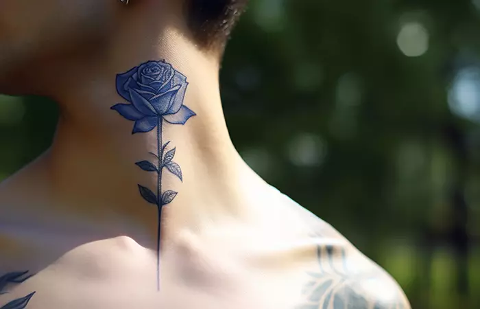 A minimal blue rose neck tattoo