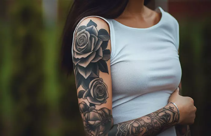 Realistic black rose tattoo sleeve