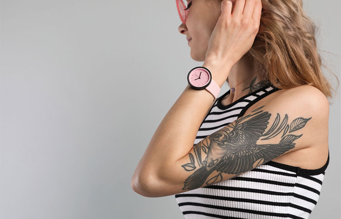 A woman flaunting a 6x6 upper arm tattoo