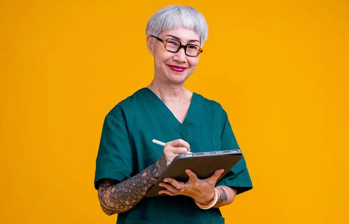 An elderly nurse with tattoos