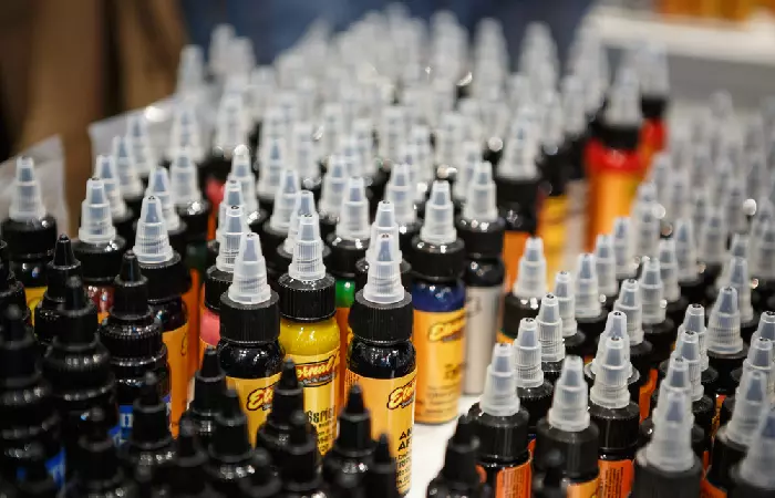 Bottles of tattoo inks stored on a table
