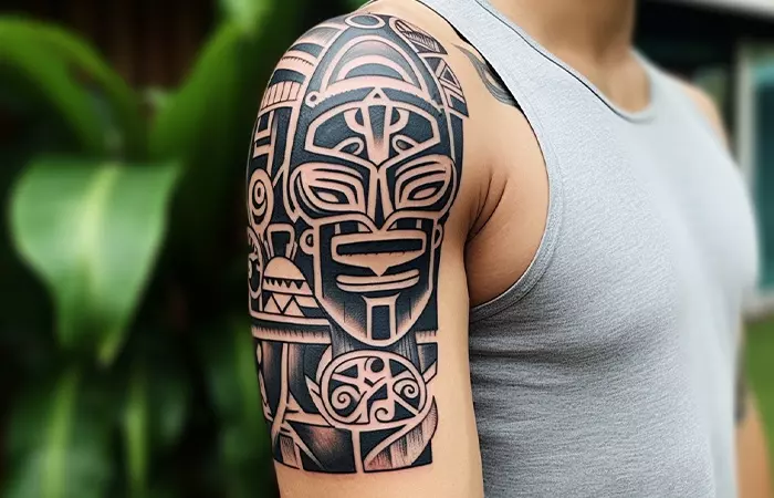A man with a marquesan tattoo on his shoulder