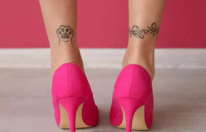 Close up of a pair of minimalist tattoos near the ankles