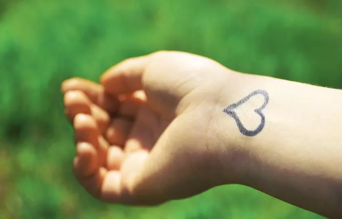 Heart tattoo on the wrist of a woman