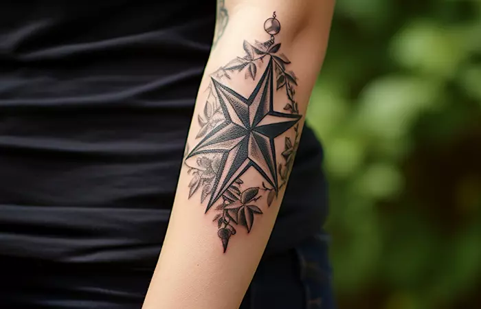 Close up of nautical star tattoos on the arm
