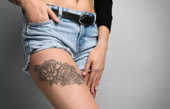 Smooth tattooed skin on the thigh
