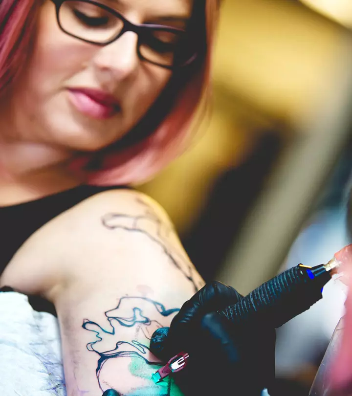 Woman gets a new tattoo