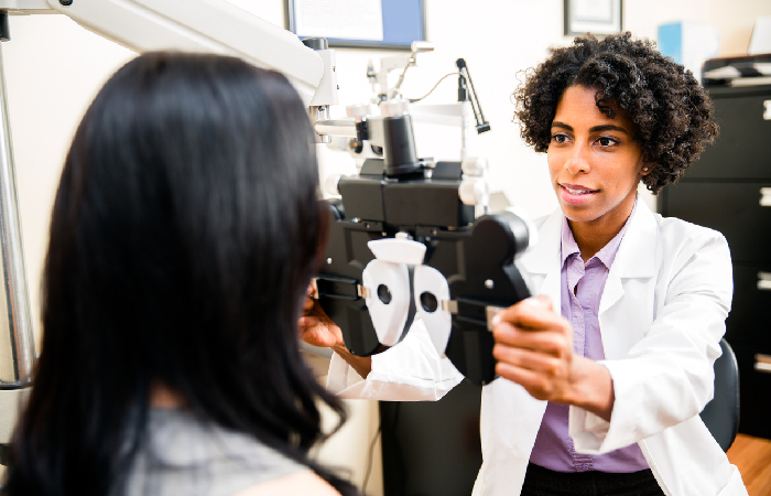 Woman getting her eyes checked before getting scleral tattoos