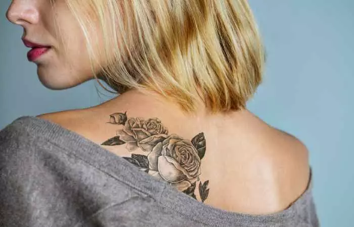 Woman with vegan tattoo ink on her back