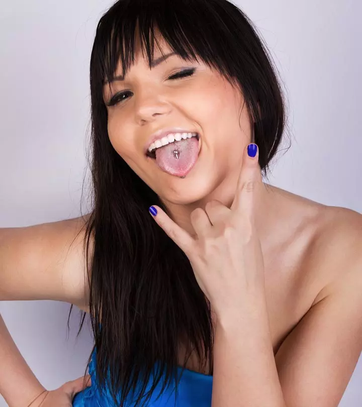 A woman flaunts her tongue piercing Image: Shutterstock