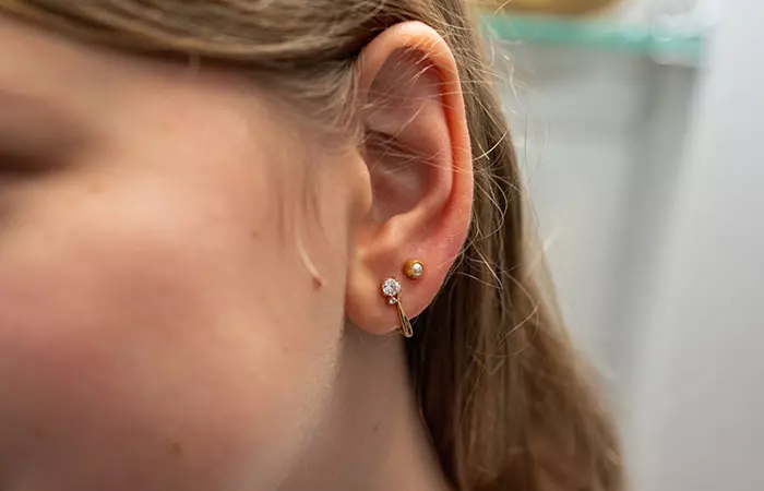 A girl with a double ear piercing