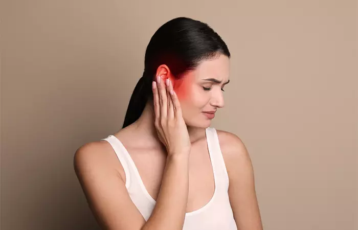 A woman experiencing ear pain