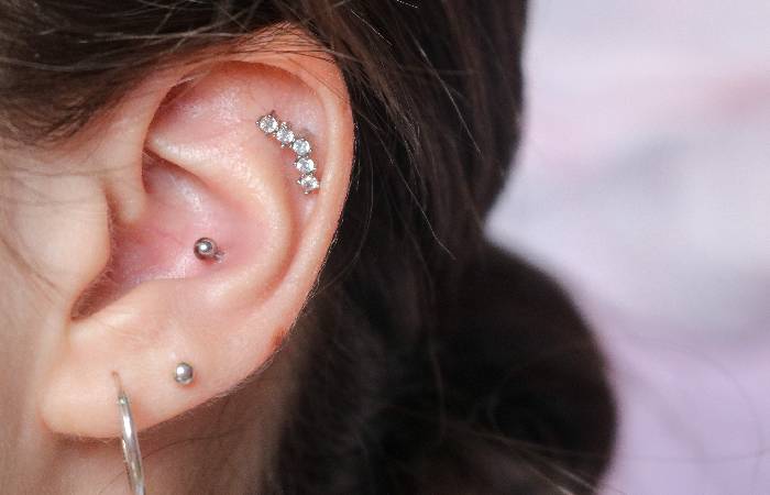 A woman sports a conch piercing