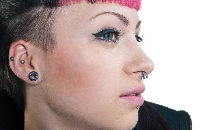 A woman sports a snug piercing