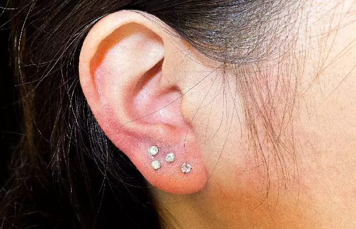 A woman sports a stacked lobe piercing
